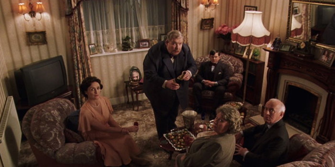 The Dursleys and the Masons sitting in their living room in Harry Potter. 
