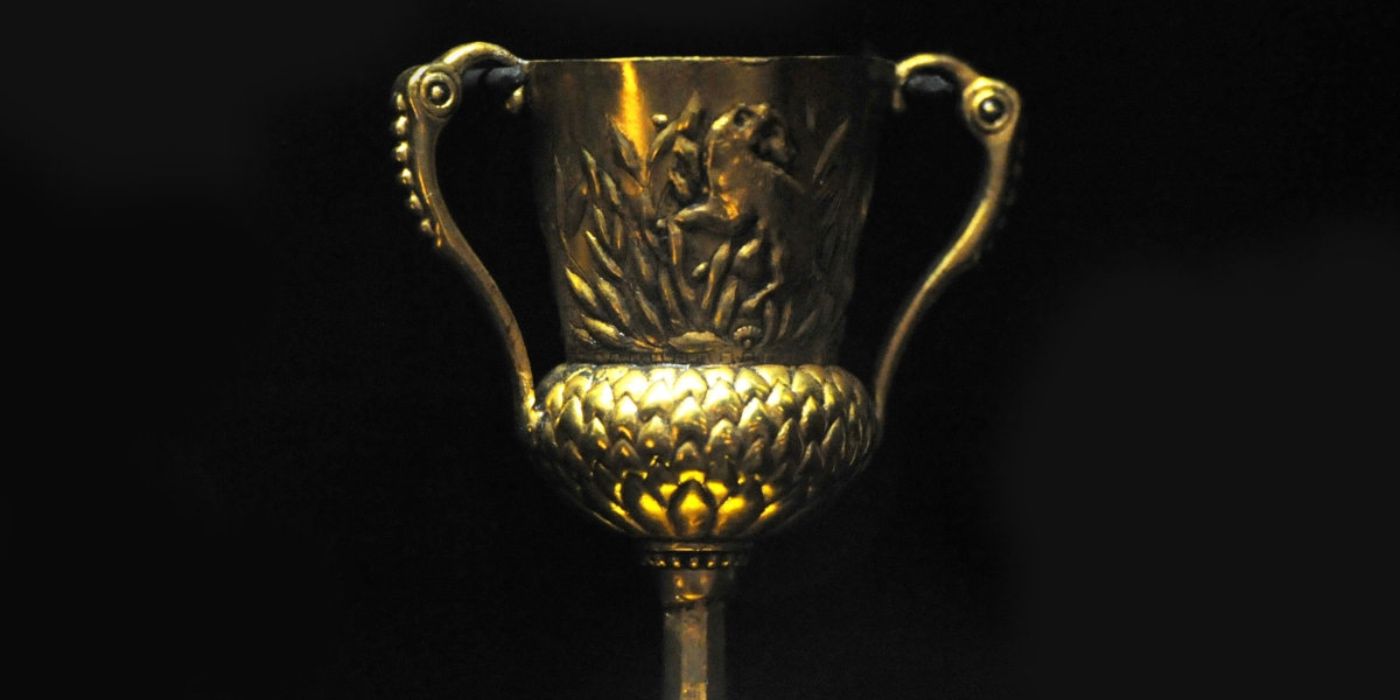Helga Hufflepuff's cup against a black baground in Harry Potter