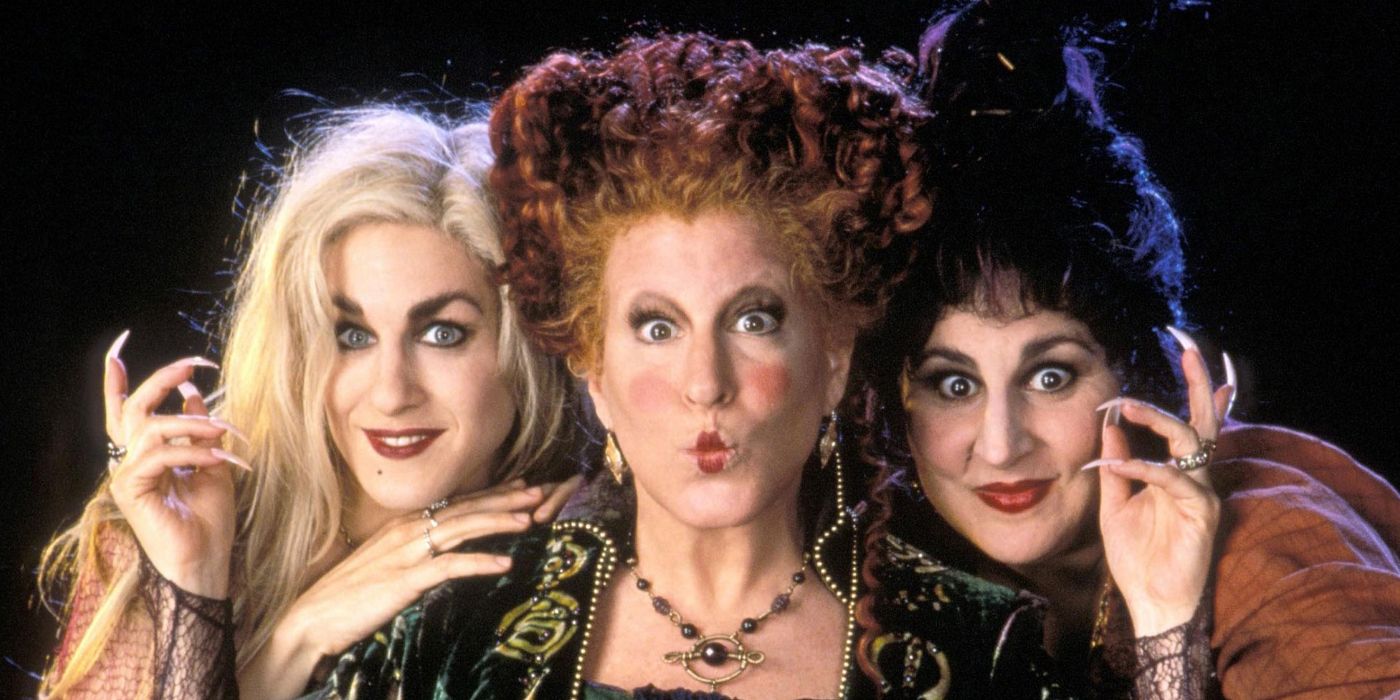 Sarah, Winifred, and Mary Sanderson smile for the camera in a promotional image for Hocus Pocus