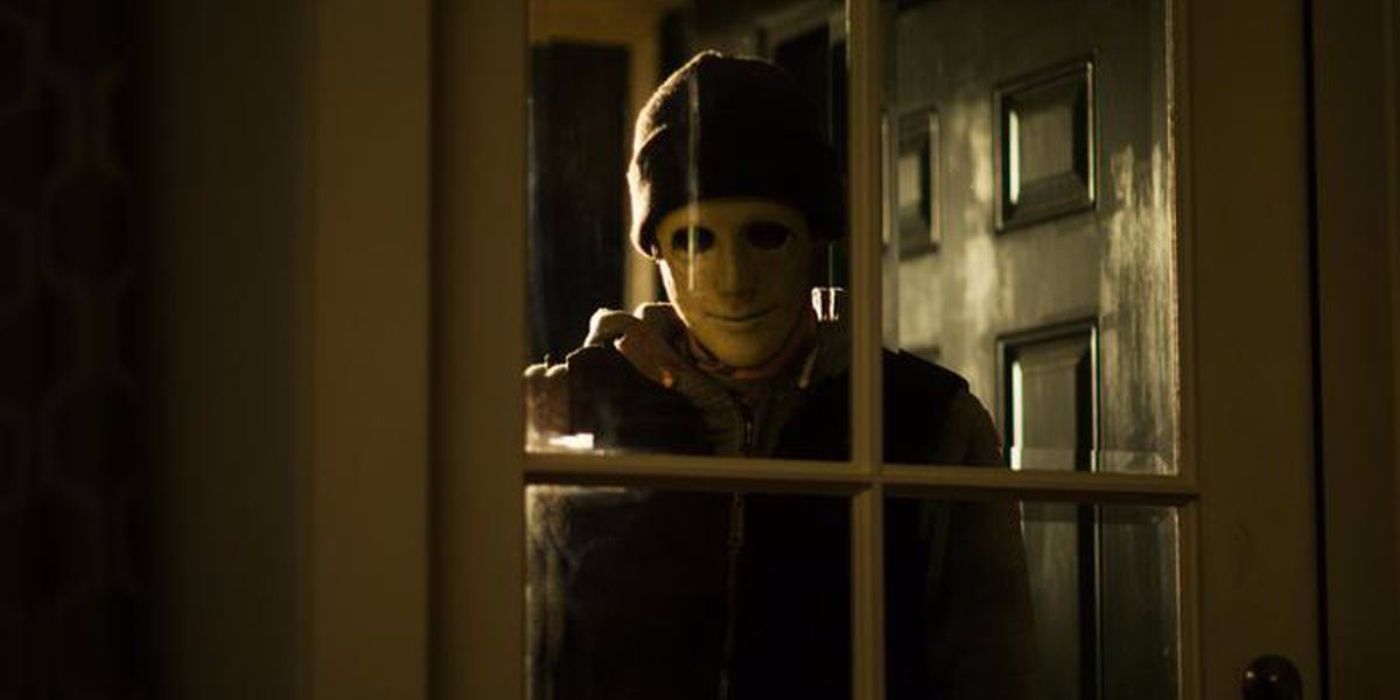 The intruder in Hush looking through the window.