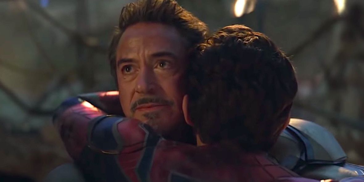 Iron Man smiles and looks up as Peter hugs him in Avengers: Endgame