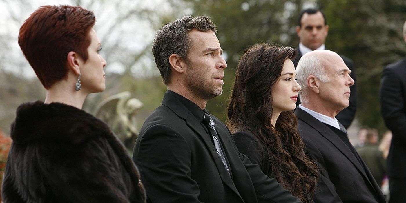 The Argent family at a funeral in Teen Wolf.