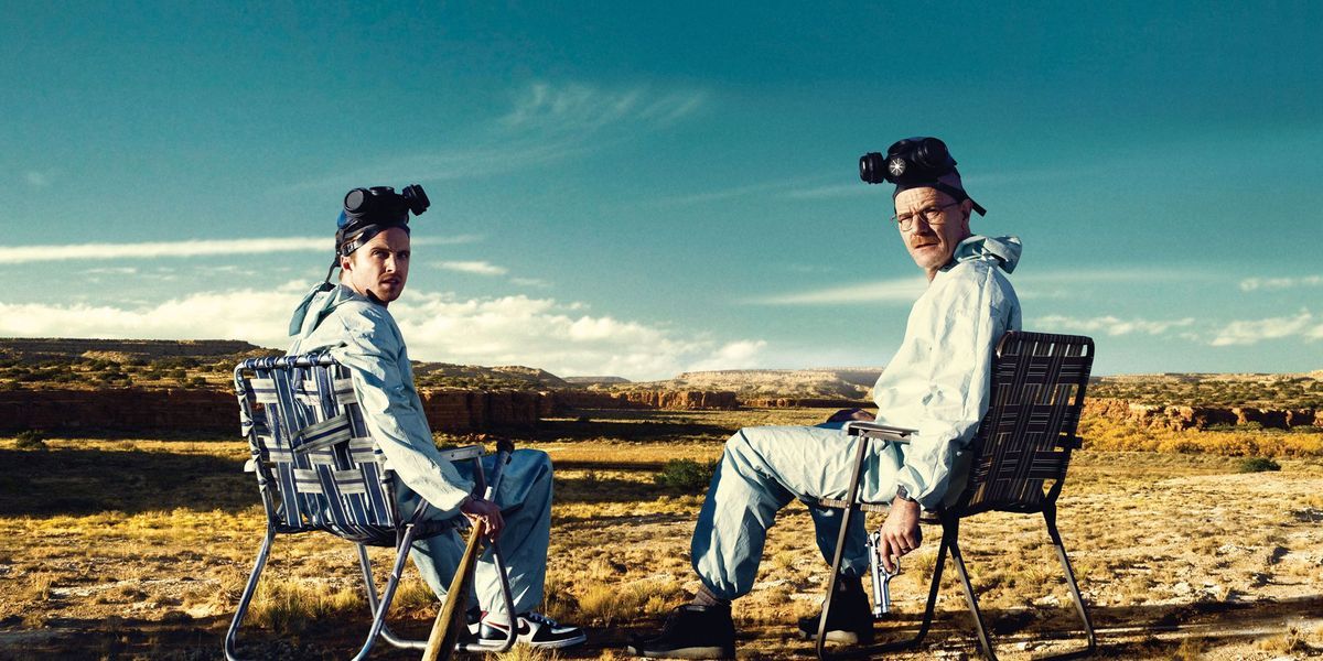 Walter and Jesse in hazmat suits in the desert in Breaking Bad.