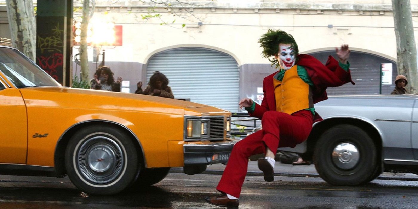 Joaquin Phoenix as joker getting hit by a car