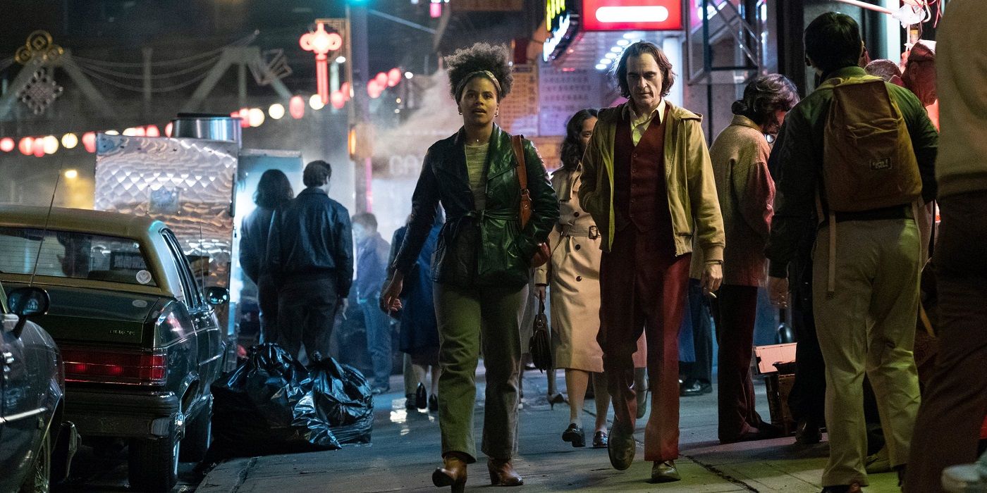 Arthur and Sophie walking down the street in Joker