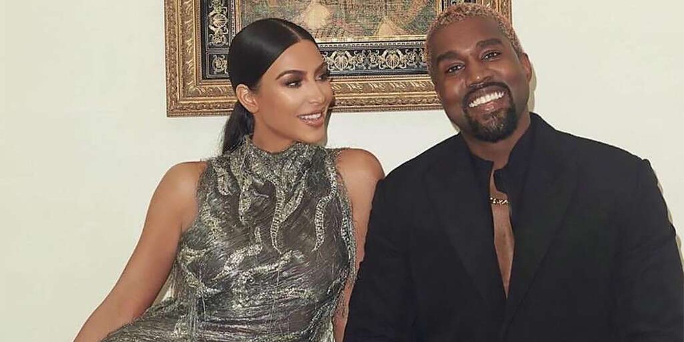 Kim Kardashian and Kanye West Keeping Up with the Kardashians smiling dressed up