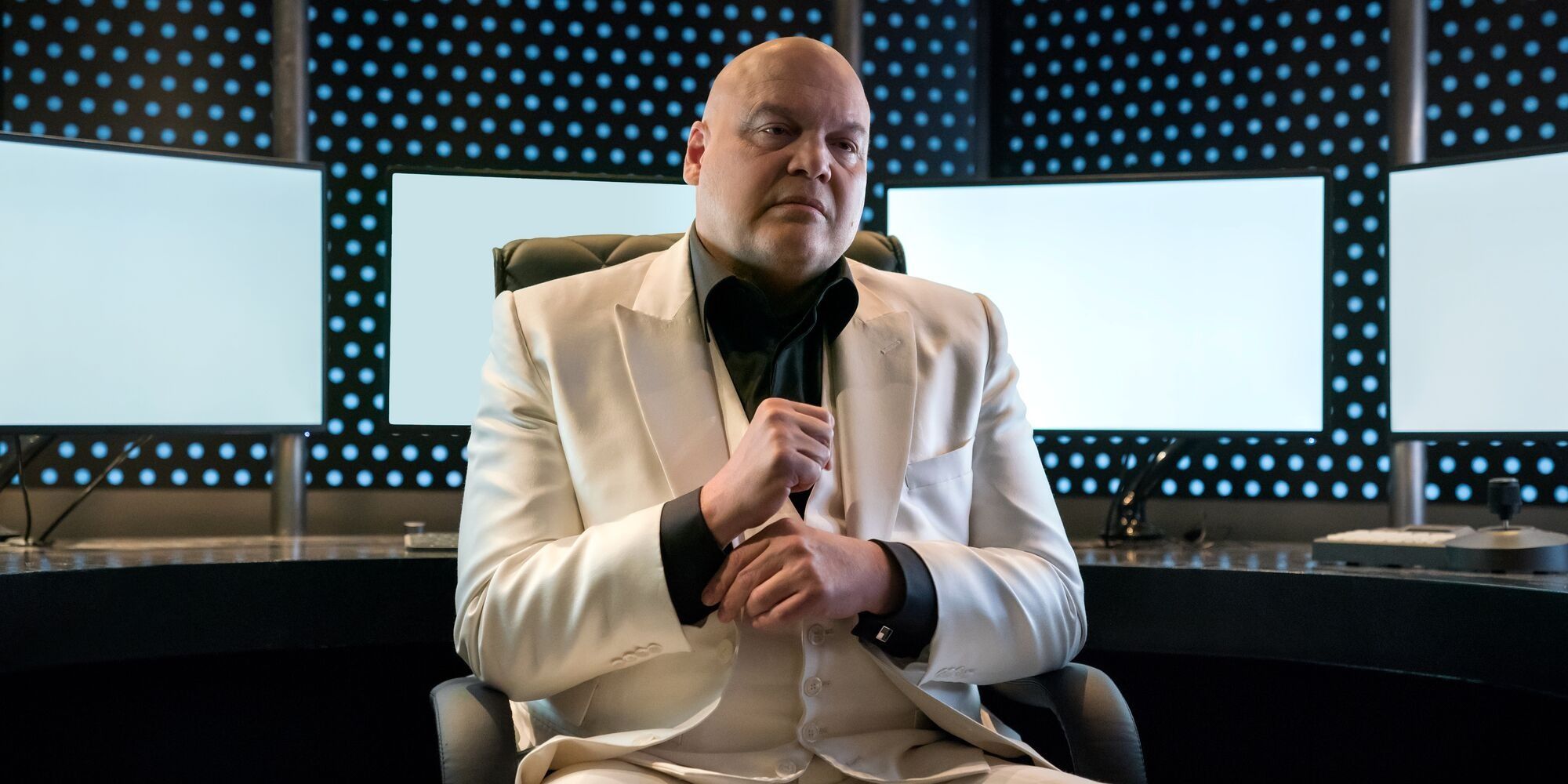 Wilson Fisk sits in chair in his white suit