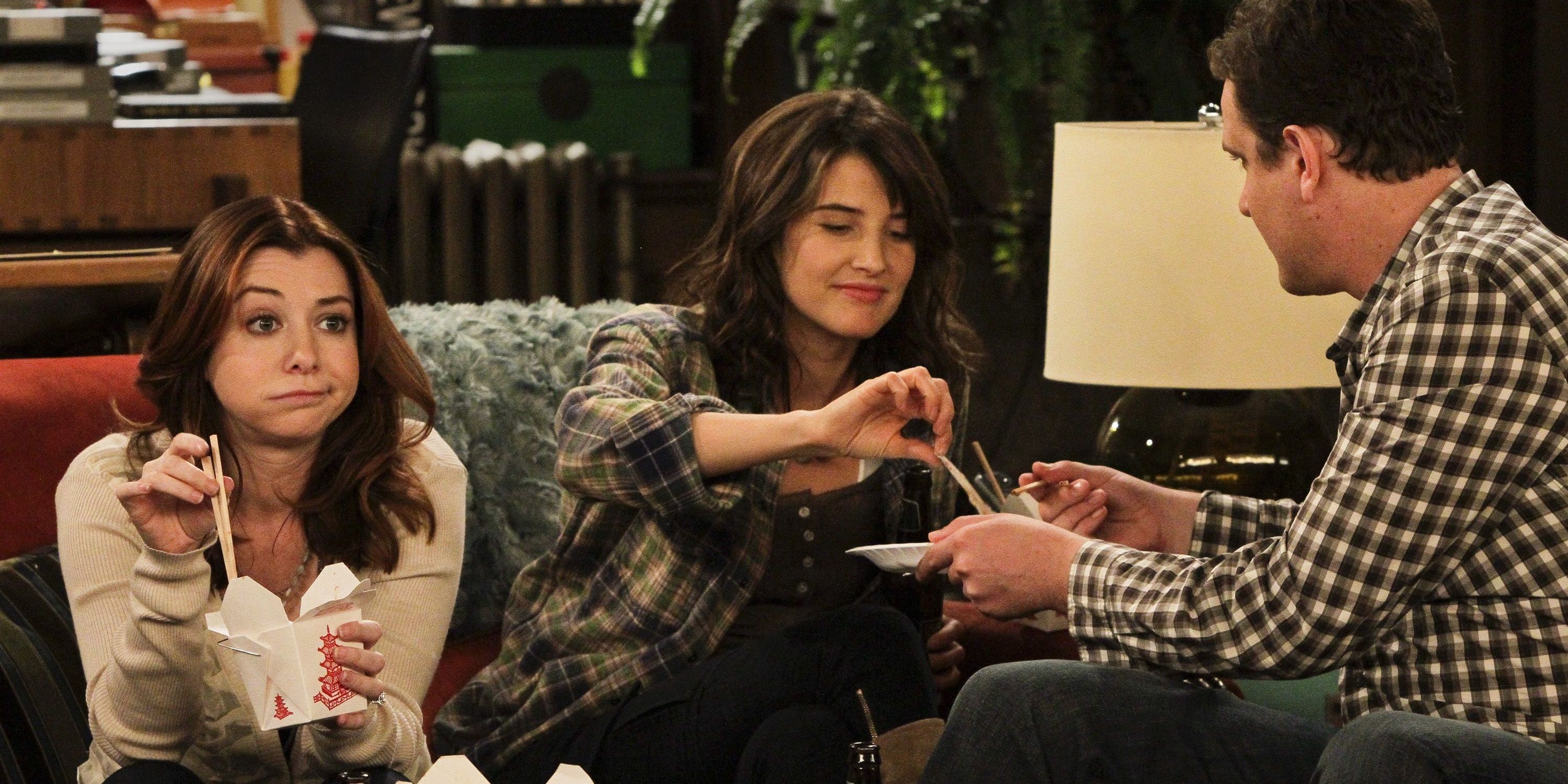 Lily, Robin, and Marshall on the couch in How I Met Your Mother.