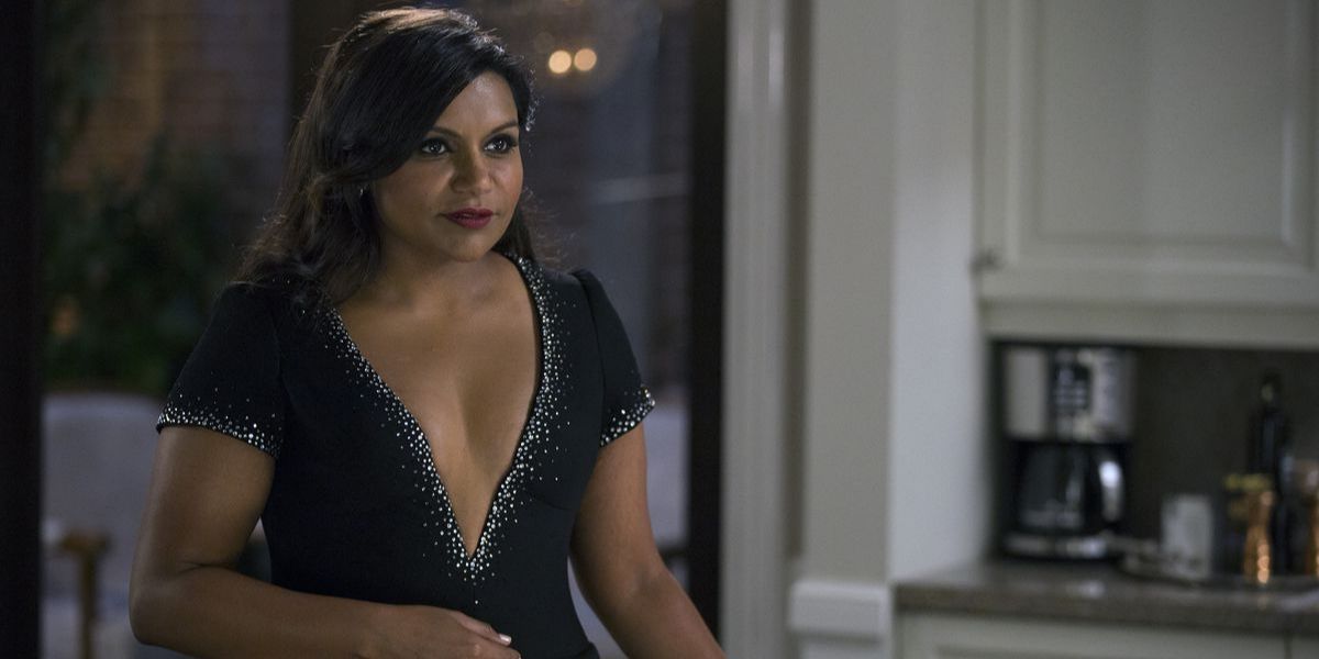 Mindy Kaling wearing a sparkly low cut dress in The Mindy Project.