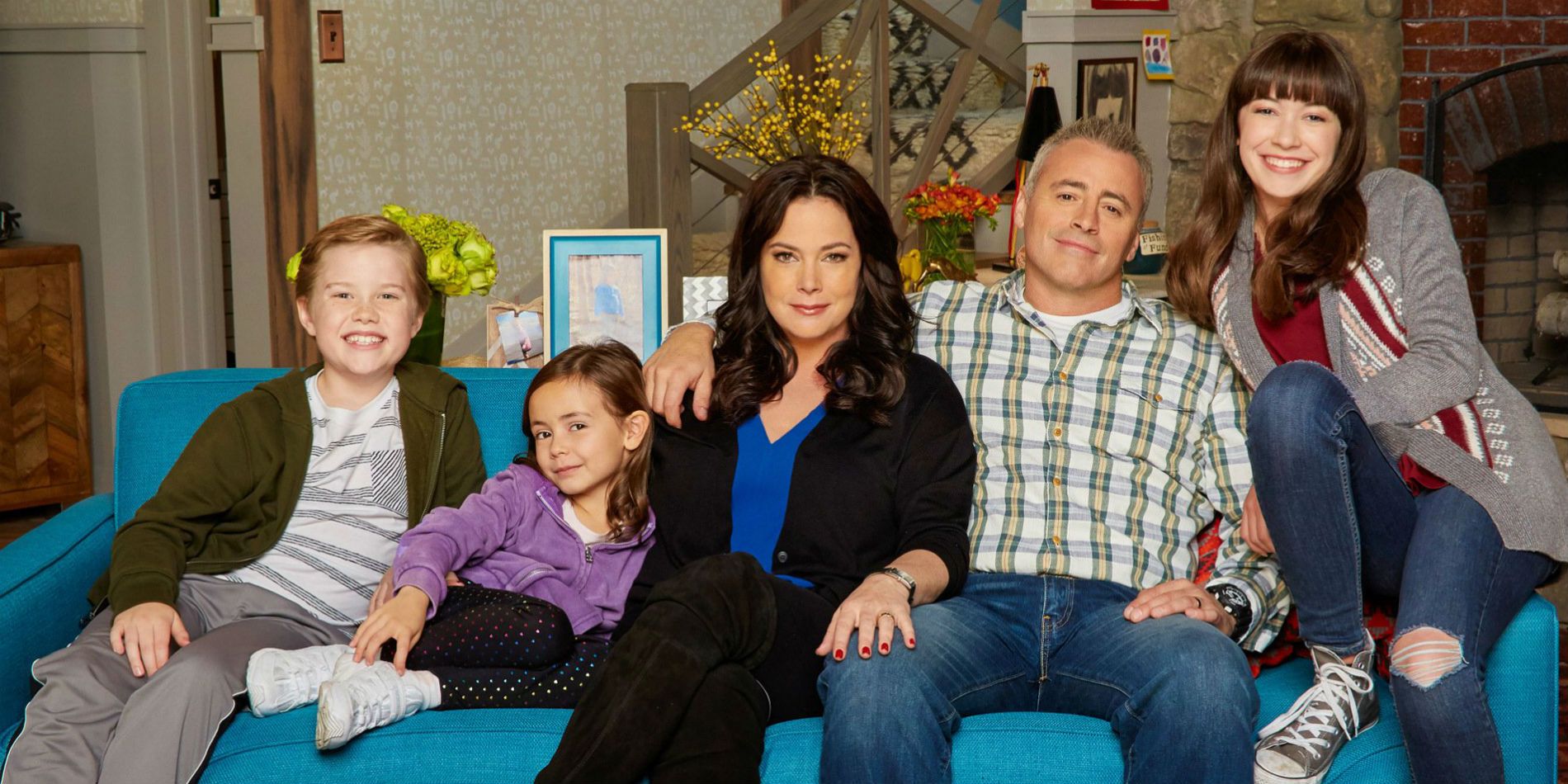 The Burns family on their couch in Man With A Plan