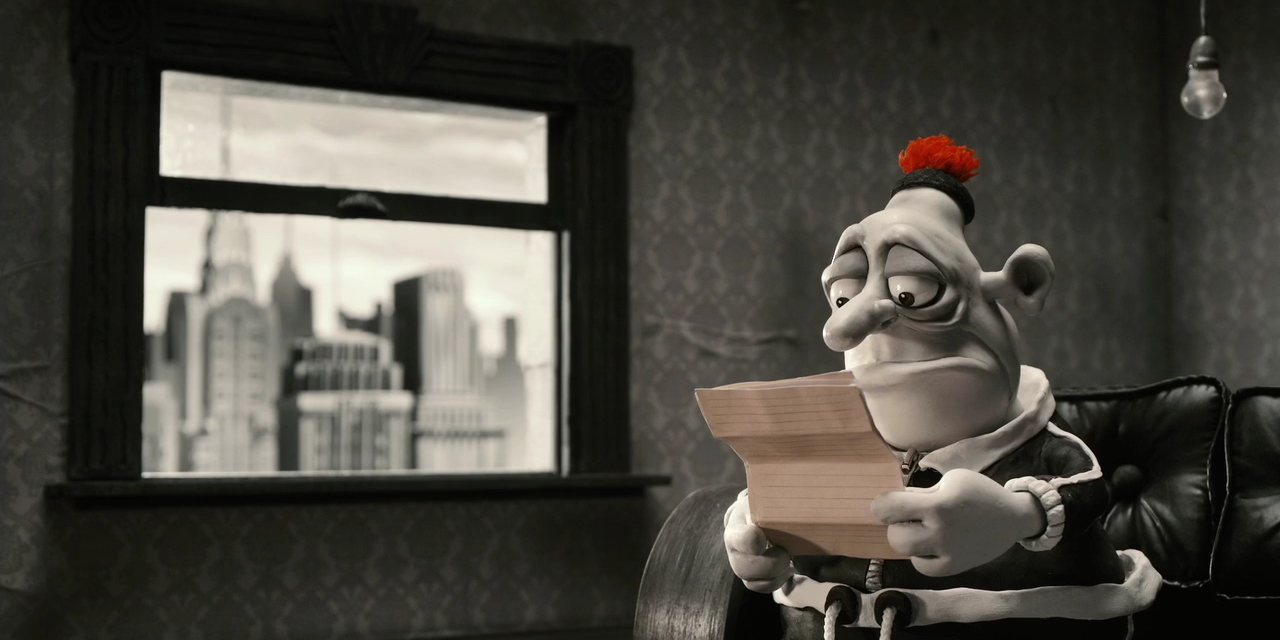 Max holding a letter in his apartment in Mary and Max.