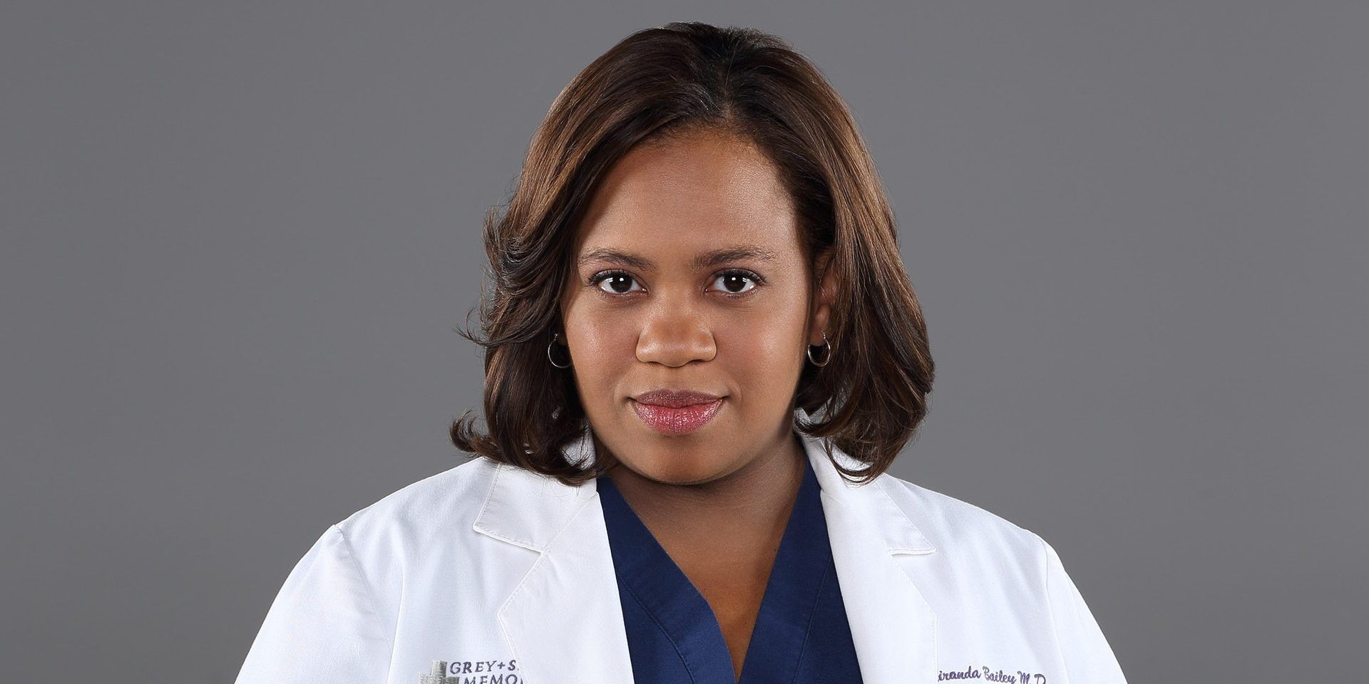 Miranda Bailey smiling in front of a grey background