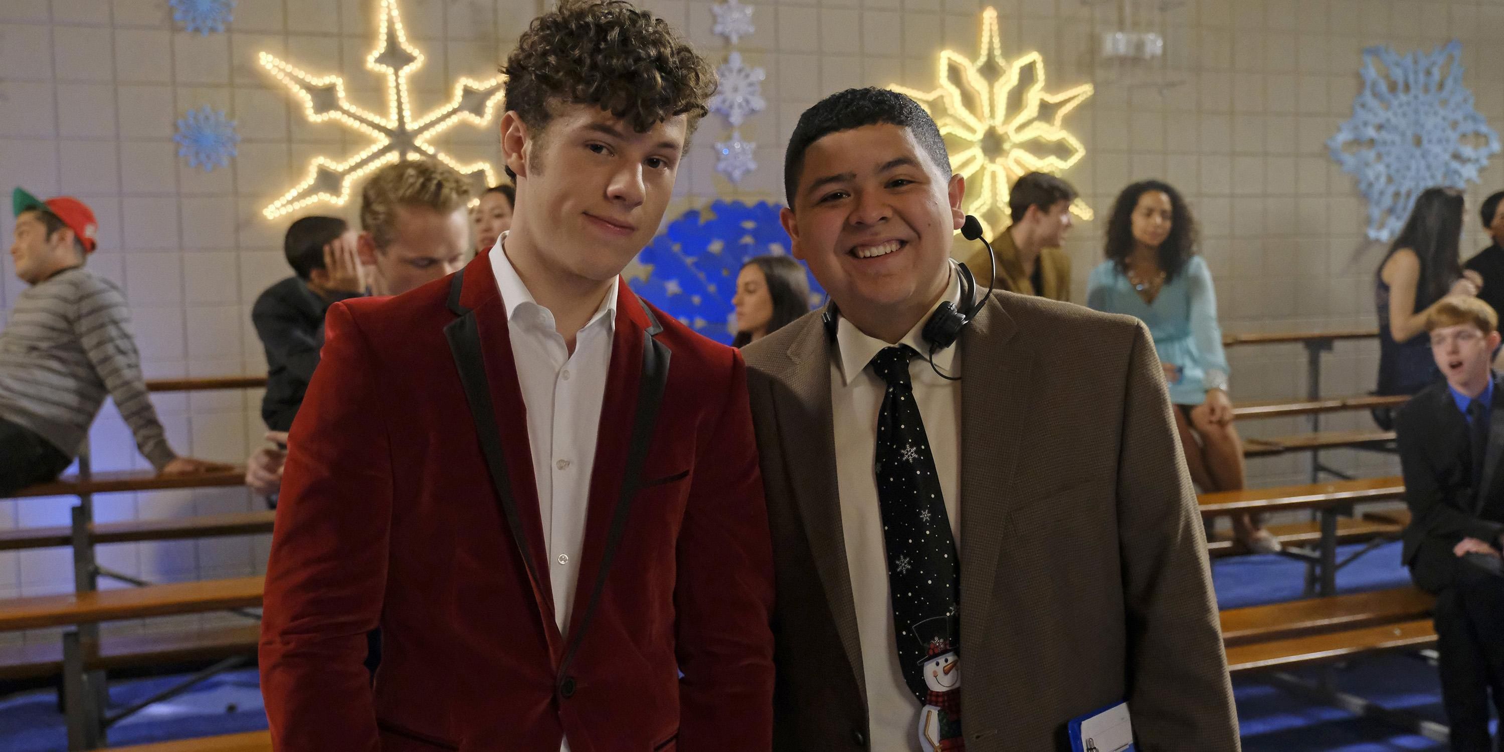 Luke and Manny smiling at the school dance on Modern Family