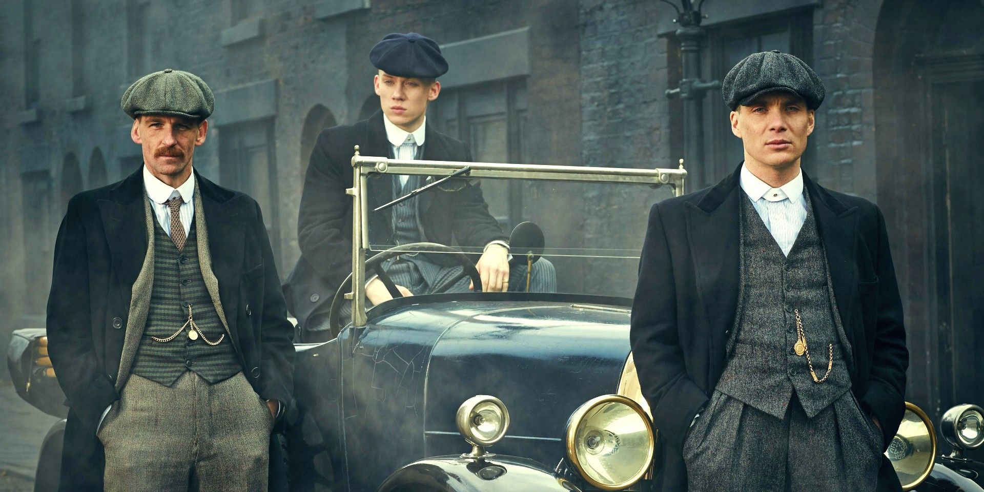 An image of Arthur and Thomas Shelby standing by a car in Peaky Blinders