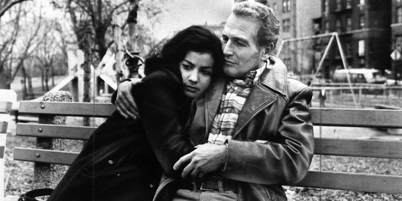 Paul Newman sitting on a bench in Fort Apache The Bronx