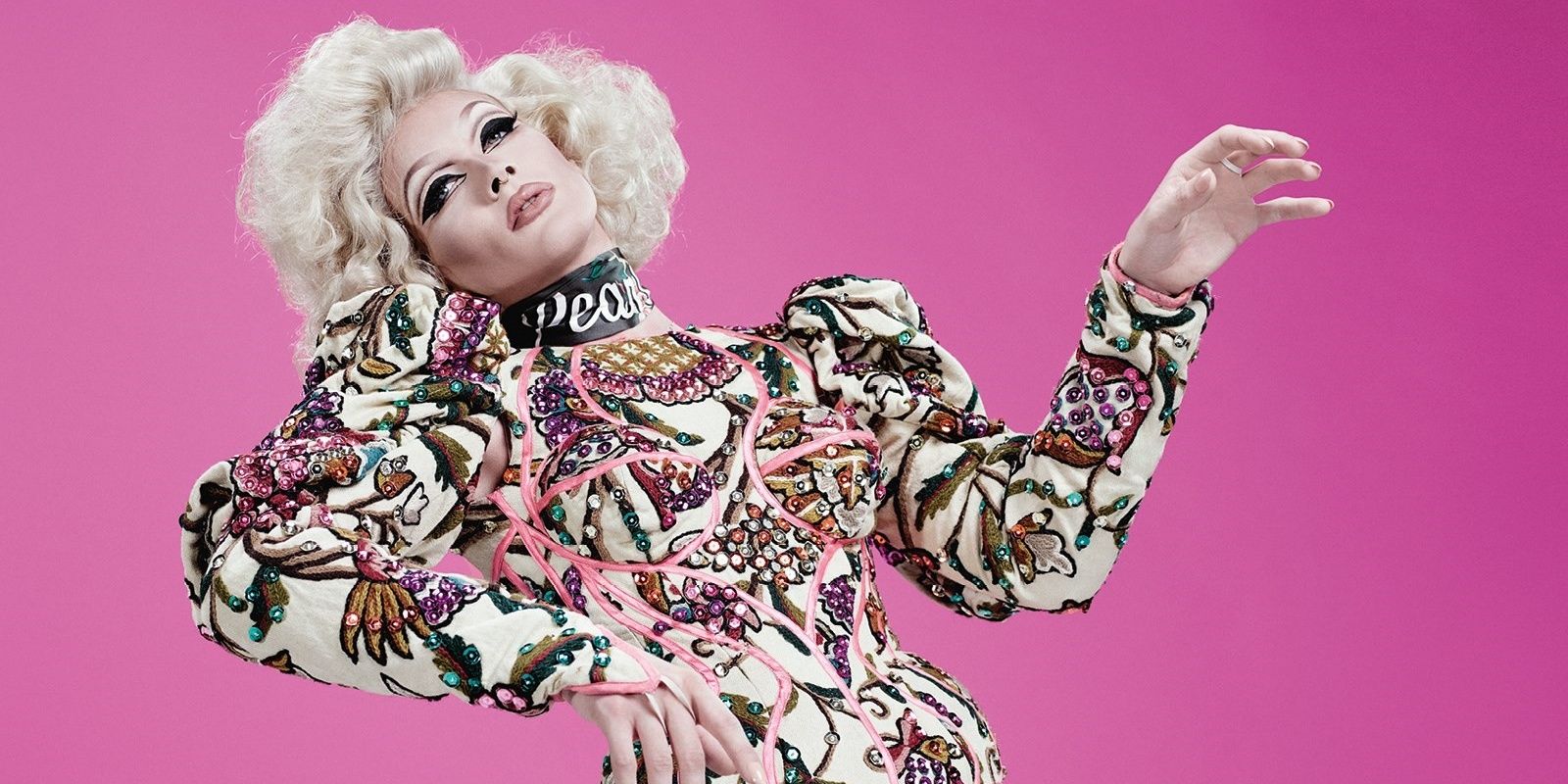Pearl from RuPaul's Drag Race posing in drag
