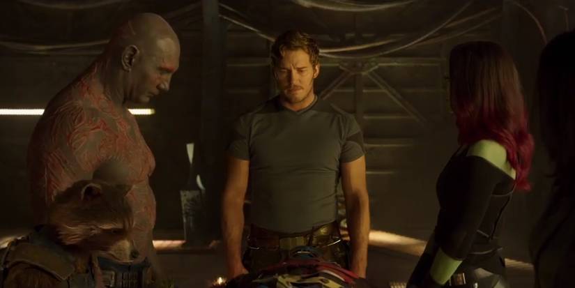 Peter Quill stands with Drax, Rocket and Gamora at Yondu's funeral in Guardians of the Galaxy 2