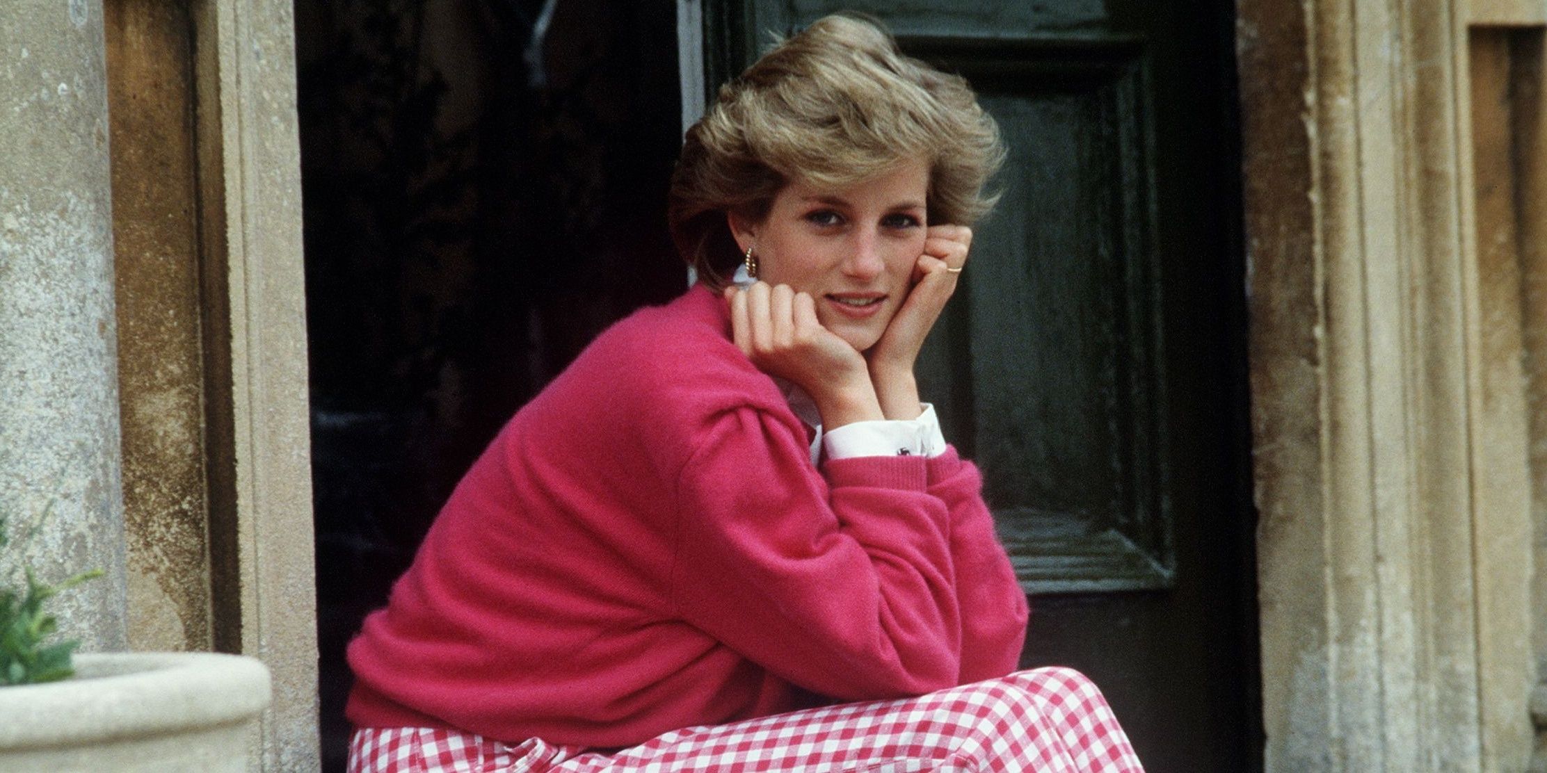 Princess Diana sitting and looking to the side