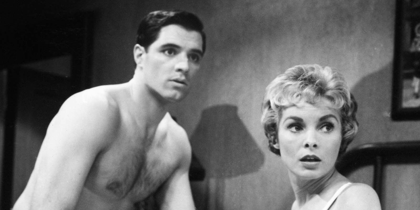 John Gavin and Janet Leigh as Sam Loomis and Marion Crane in the hotel room looking scared in Psycho.