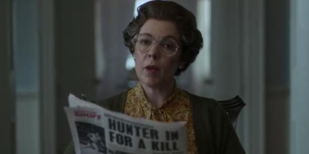 Queen Elizabeth II reading the newspaper 