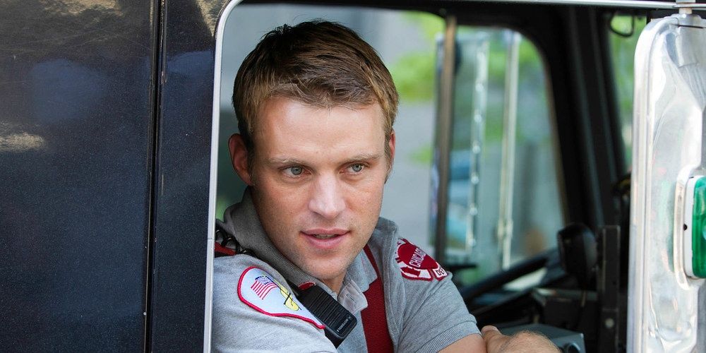 Matthew Casey talking to someone while inside a truck in Chicago Fire