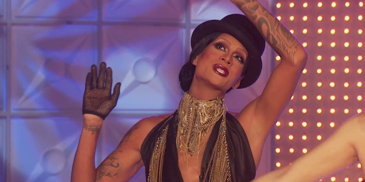Drag queen Raja persons in a bowler hat on the runway in RuPaul's Drag Race.