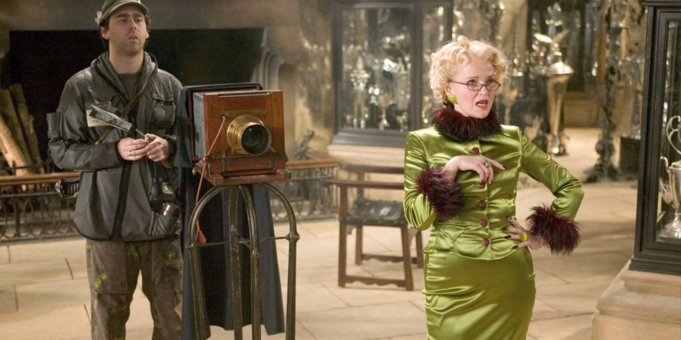Rita Skeeter standing by a camera for an interview in Harry Potter