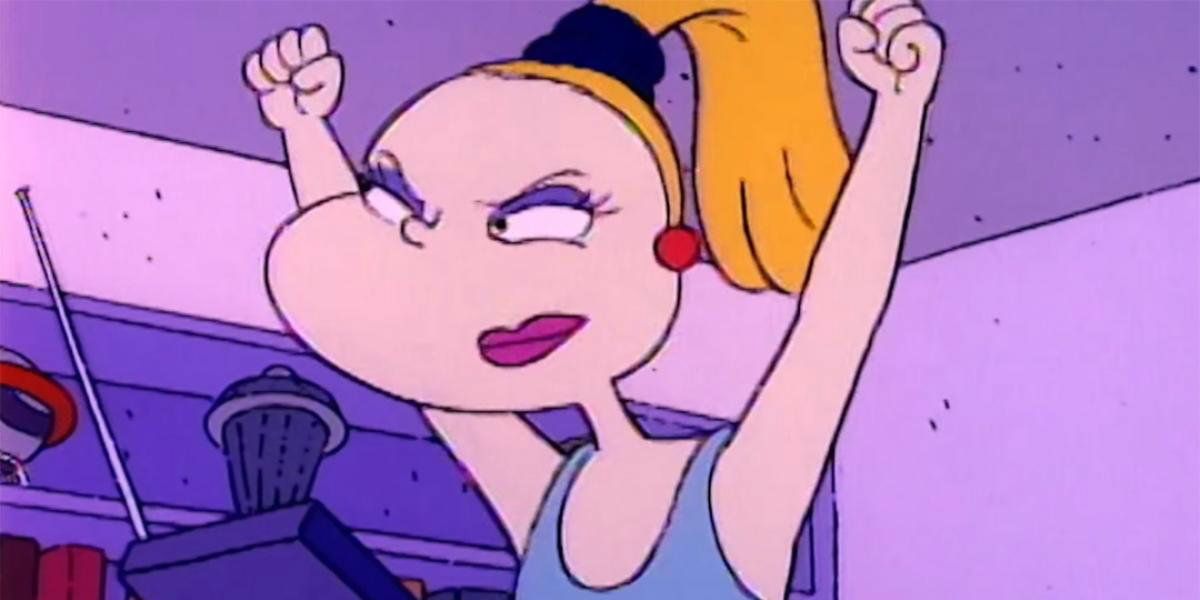 Charlotte Pickles raises her arms in the sky after a workout on Rugrats