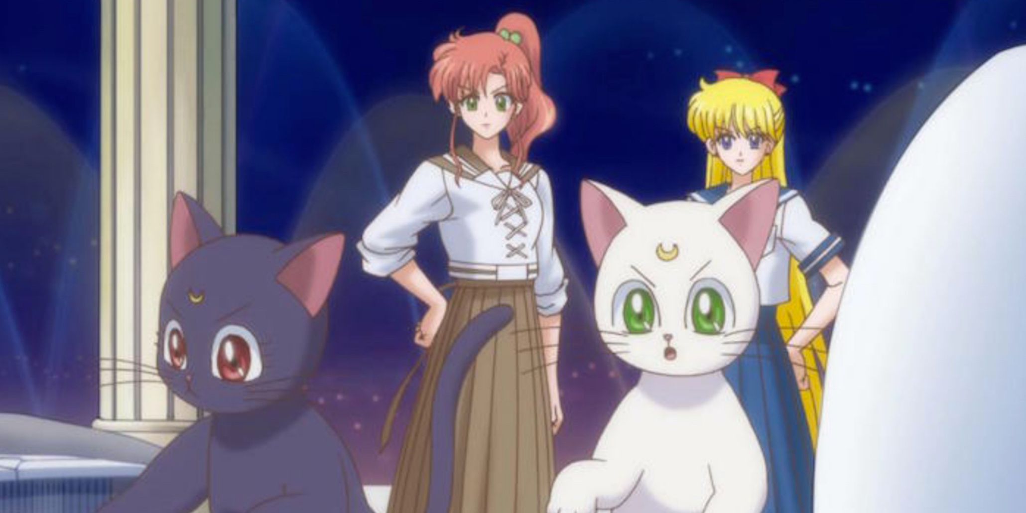 Sailor Jupiter and Sailor Venus with Luna and Artemis in the Sailor Moon Crystal Command Center