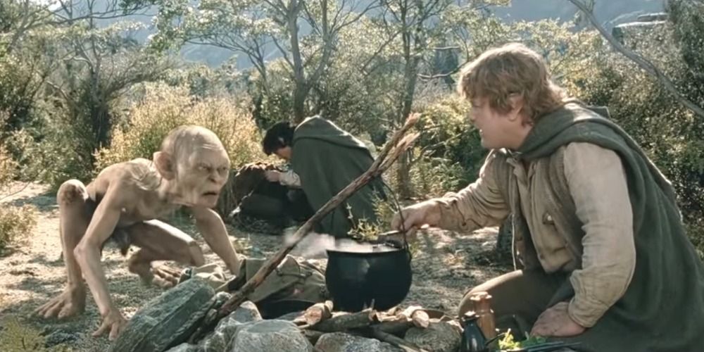 Sam, Frodo and Gollum cooking around the campfire in The Lord of the Rings