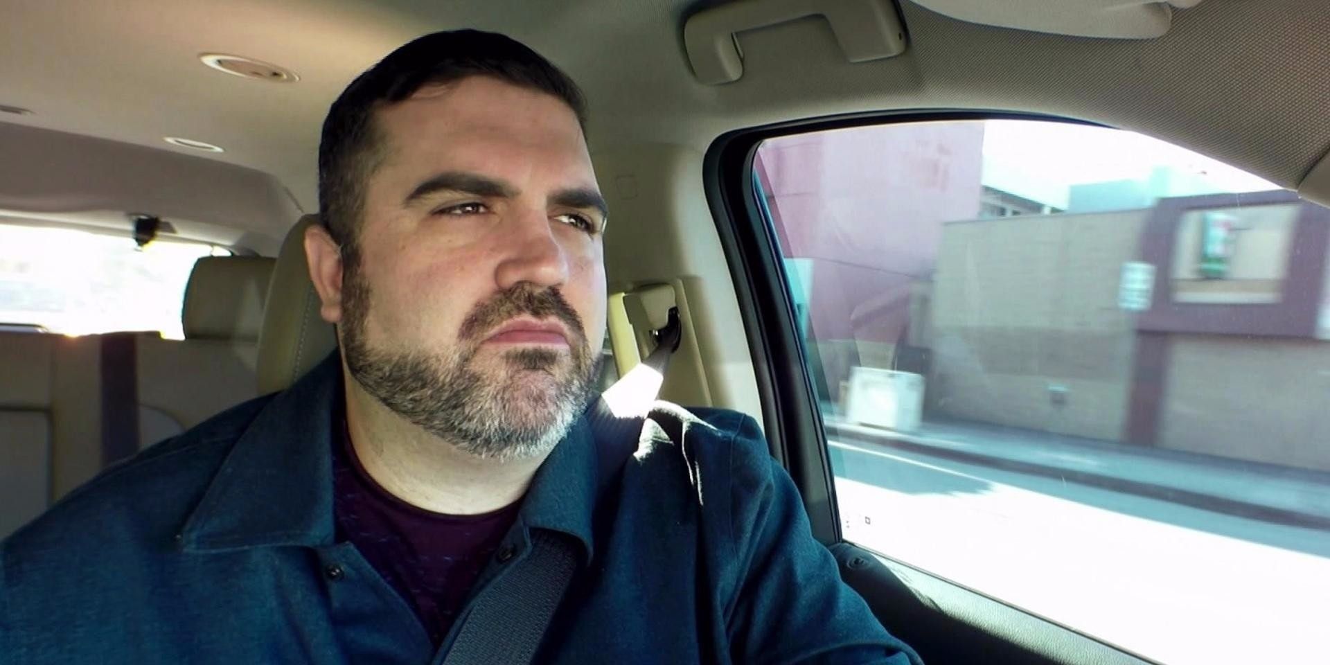 A man drives a car in Seatbelt Psychic 