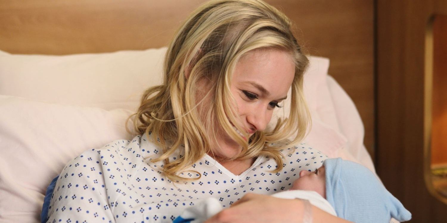 Sloan holding her baby after giving birth in Grey's Anatomy
