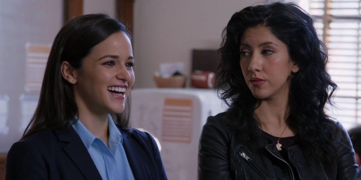 Amy smiling widely and Rosa looking at her