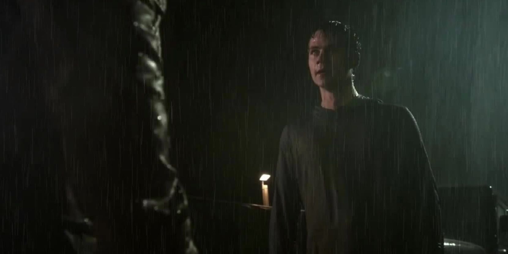 Stiles tries to talk to Scott about Donovan in the rain in Teen Wolf Season 5