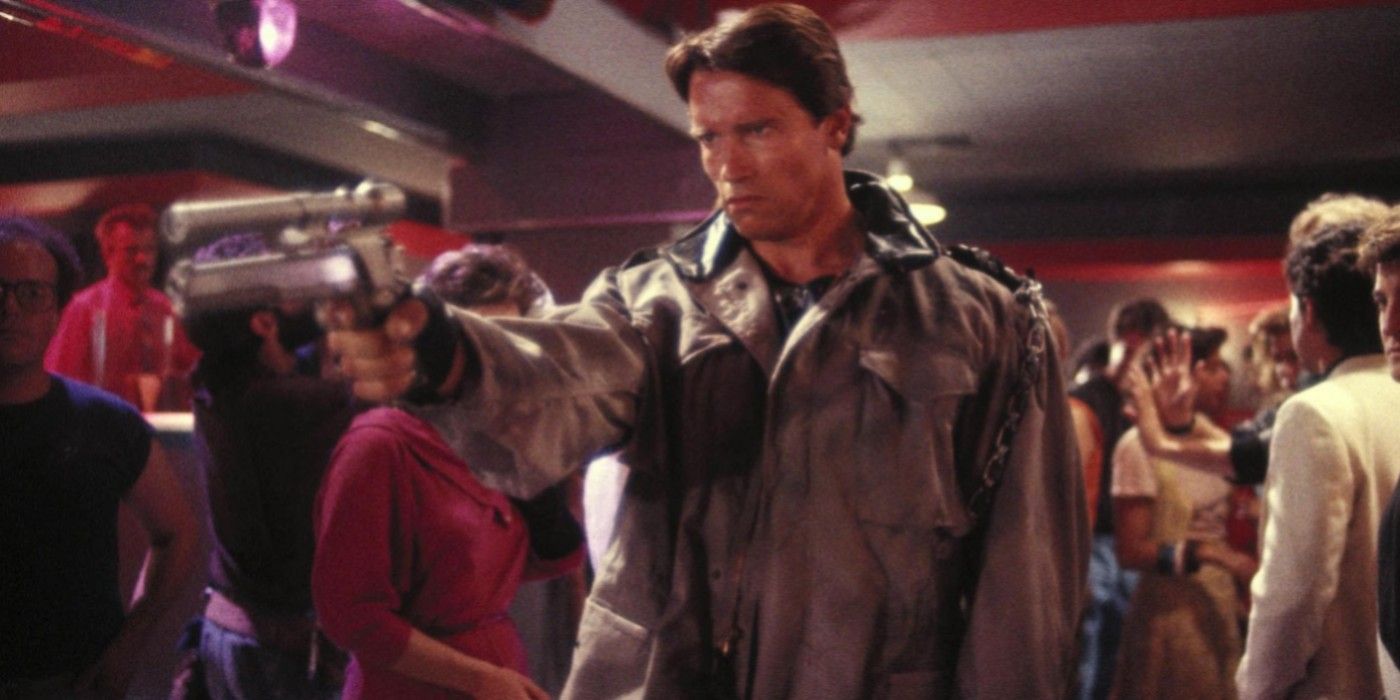 Arnold Schwarzenegger aiming a gun in The Terminator