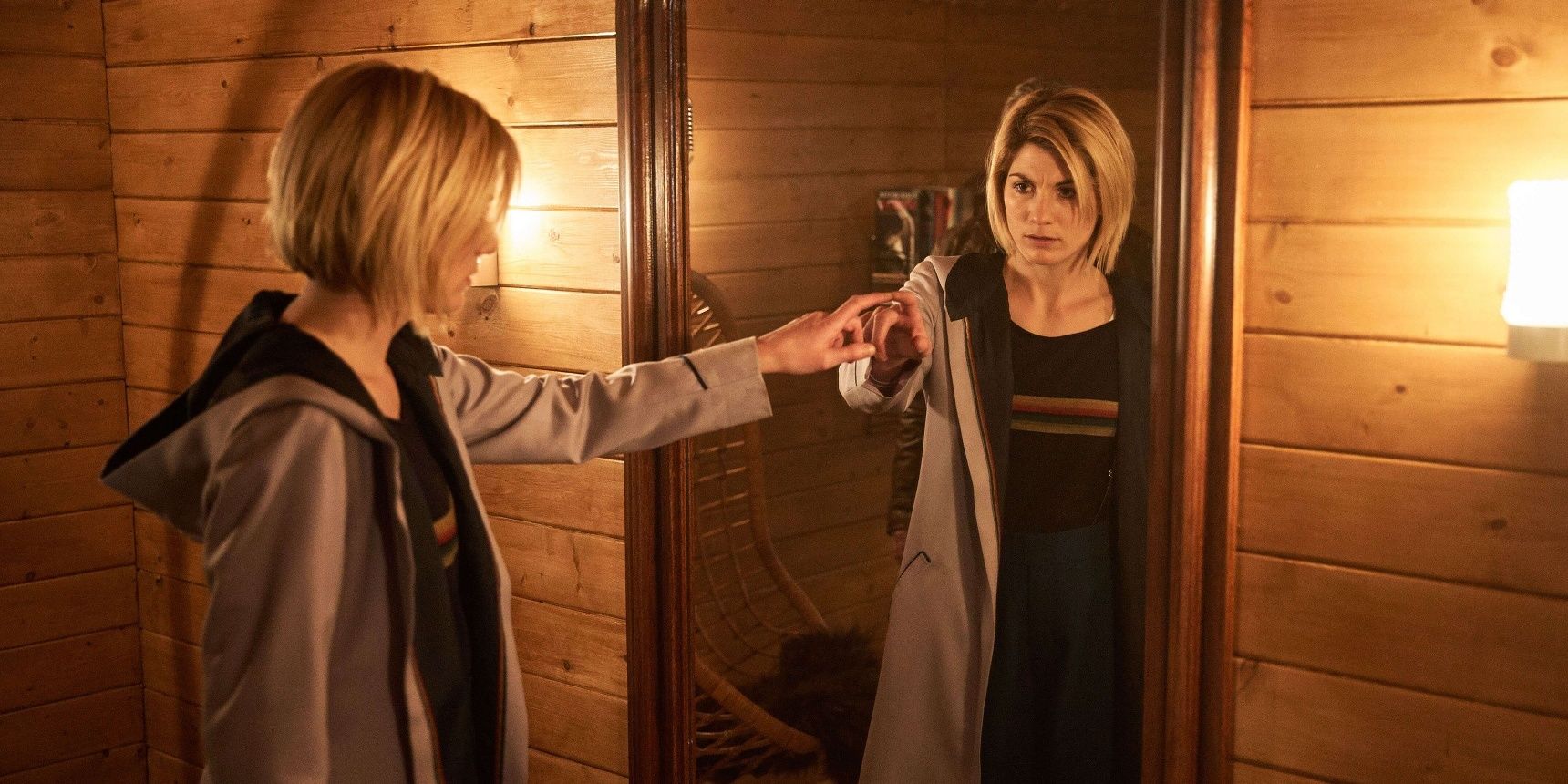 An image of Jodie Whittaker looking in a mirror in Doctor Who
