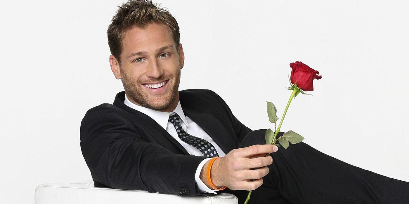 The Bachelor's Juan Pablo Galavis holding a rose smiling