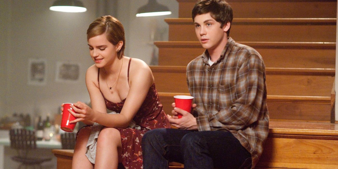 Emma Watson and Logan Lerman sitting on steps in The Perks of Being a Wallflower