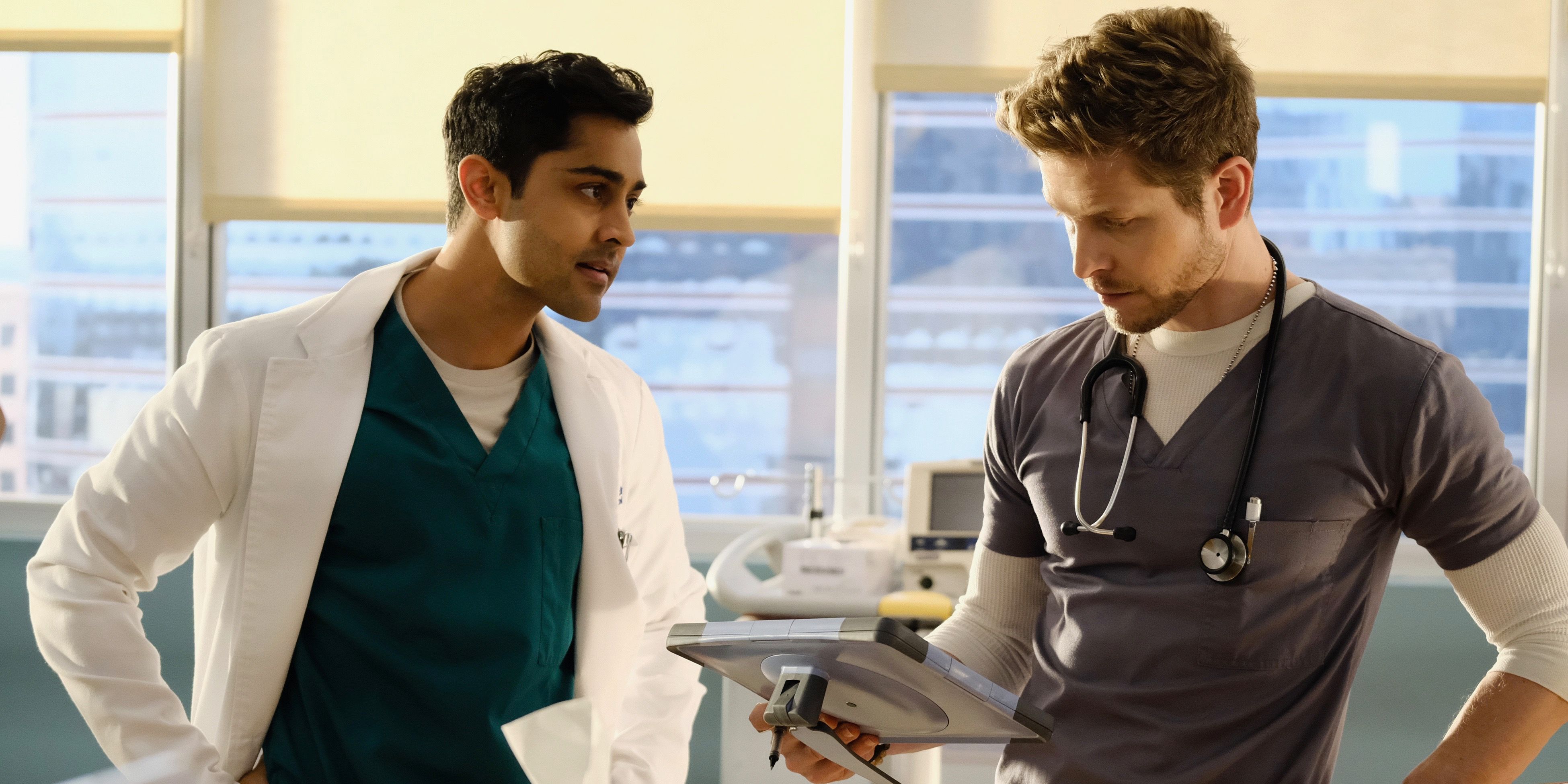 Two doctors talking in a scene from The Resident.