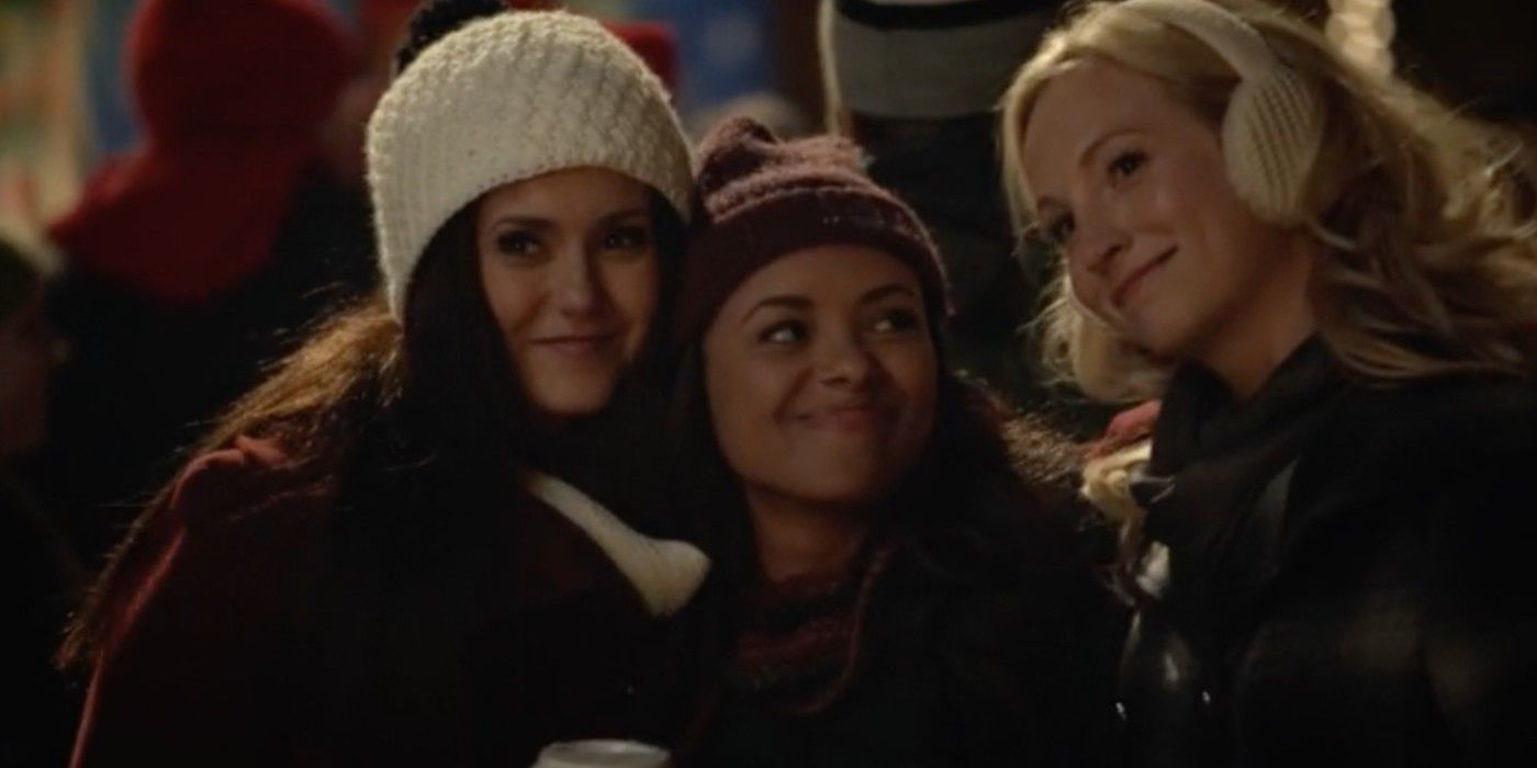 Elena, Bonnie and Caroline embracing in The Vampire Diaries