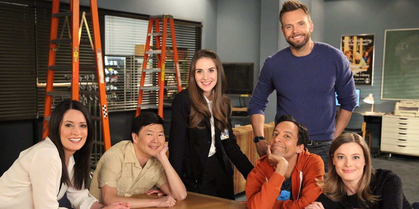 The cast of Community at the table in Community