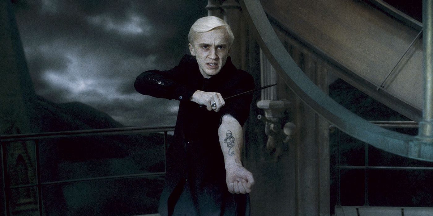 Draco shows his dark mark in Harry Potter.