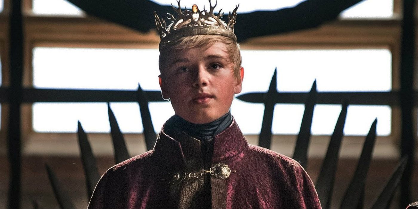 Tommen Baratheon standing nervously in front of the Iron Throne in Game of Thrones