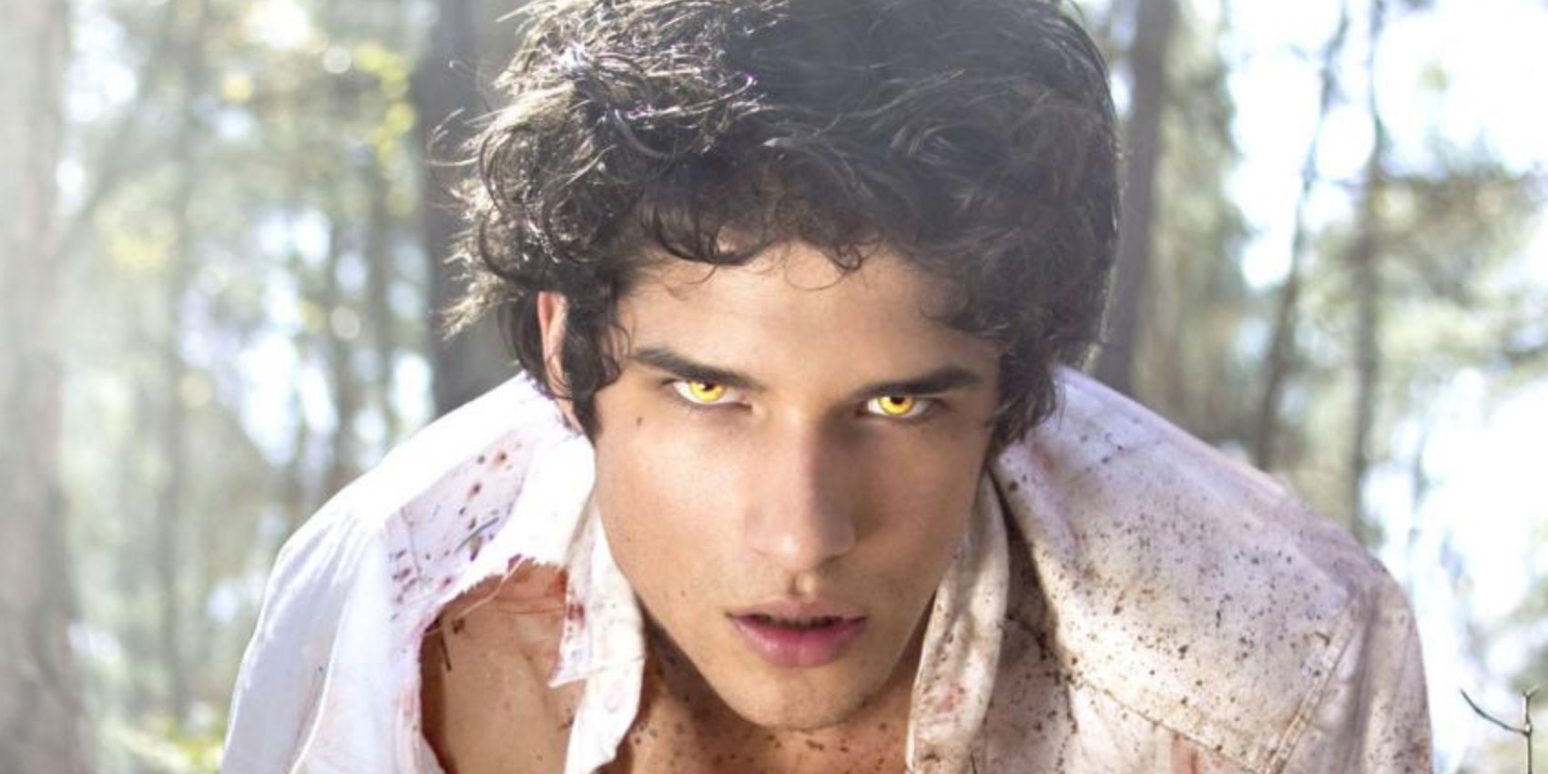 Scott McCall with a torn shirt looking into the camera in Teen Wolf