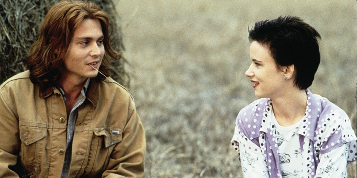 A man and a woman look and talk to each other in What’s Eating Gilbert Grape