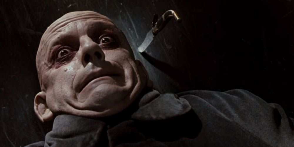 Fester gets knife launched at his face by gomez