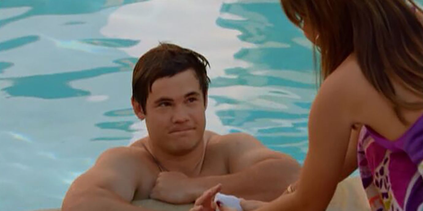 Andy swimming in the pool and talking to Haley on Modern Family