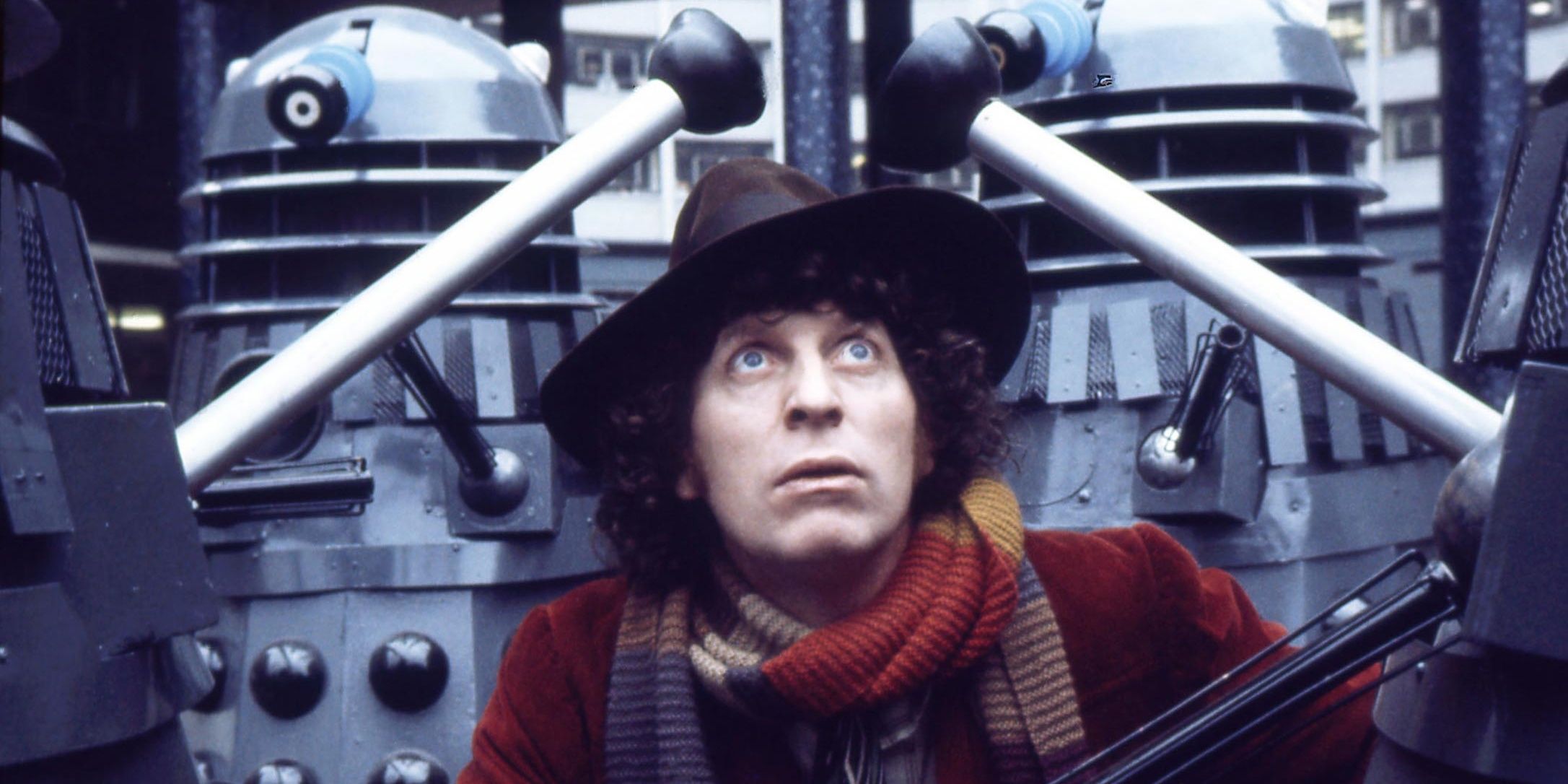 The Fourth Doctor surrounded by Daleks