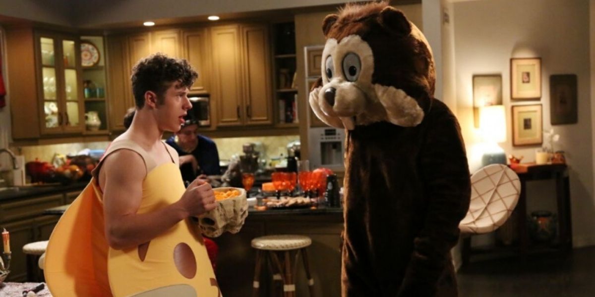 Luke and Phil dressed in costumes on Halloween in Modern Family