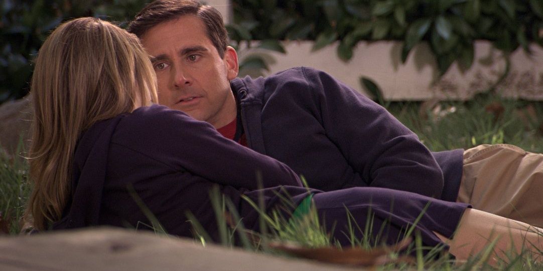 Michael Scott and Holly Flax laying in the grass on The Office.